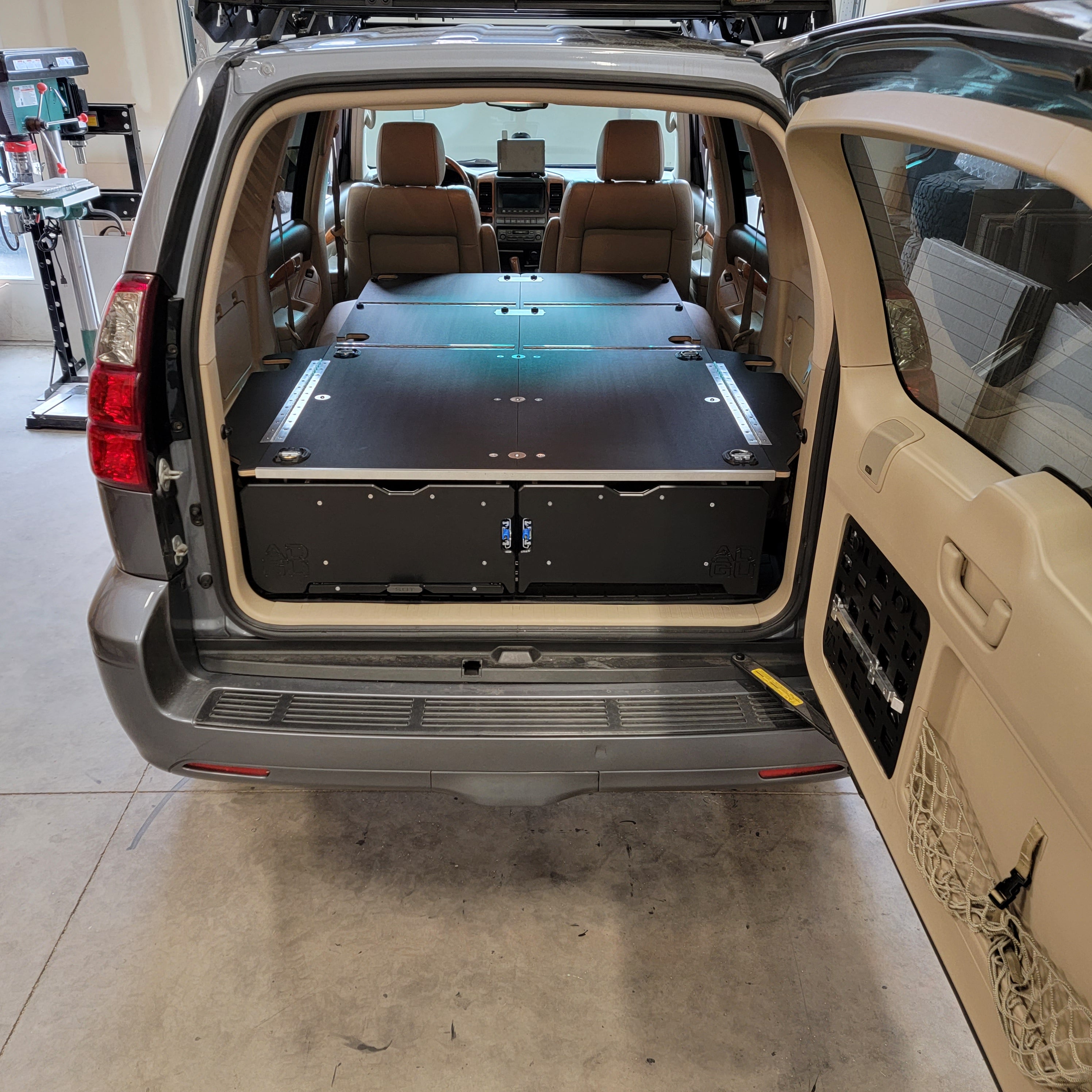 GX470 drawer system with sleeping platform for vehicle organization